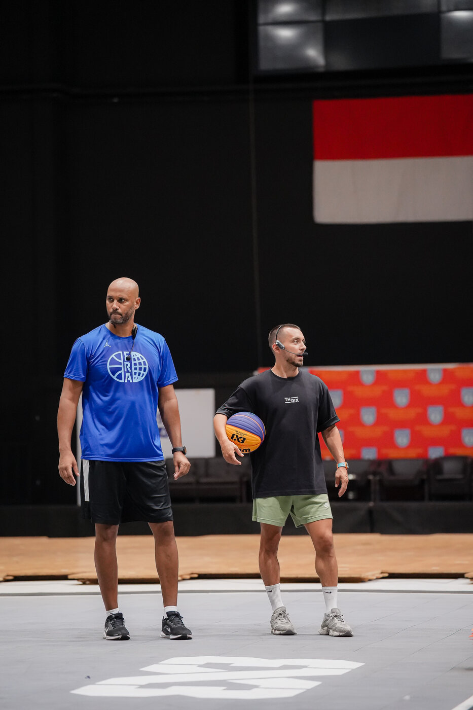 THRIX coaches on court with the Indonesian flag